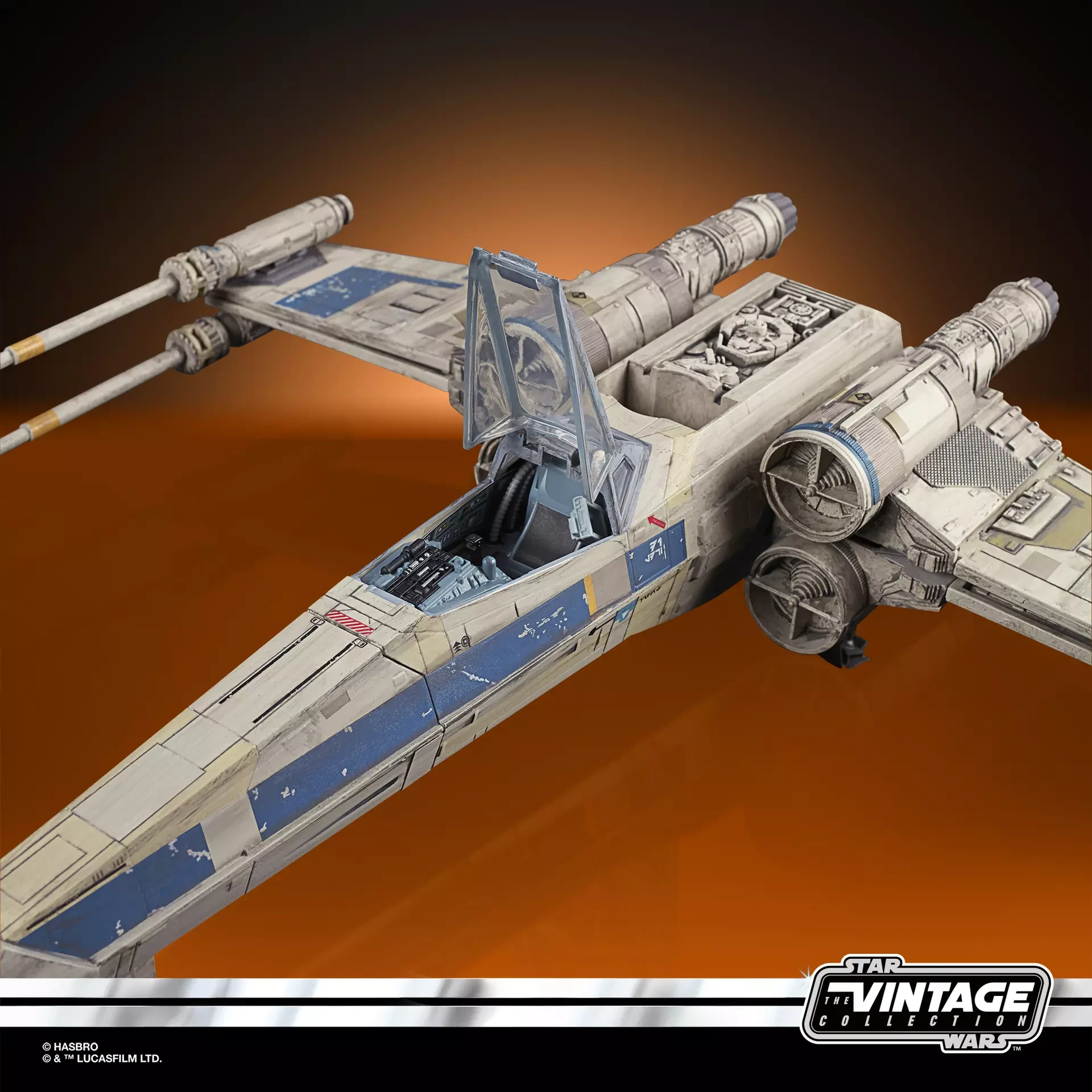 Antoc Merrick’s blue and gray X-Wing Fighter with the cockpit canopy open